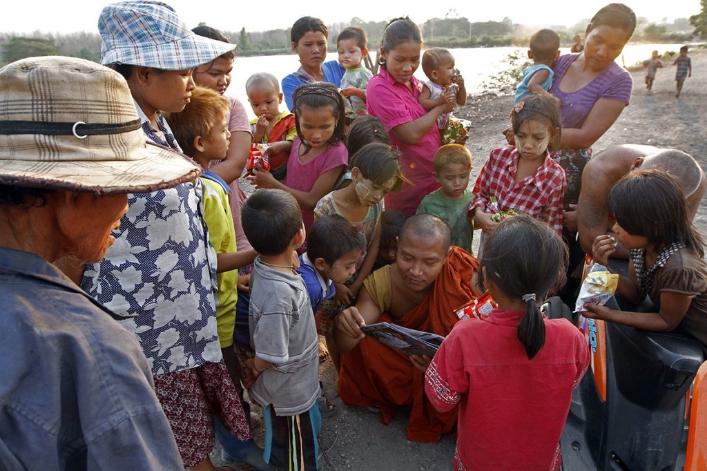 Everyone gathers round to see the book