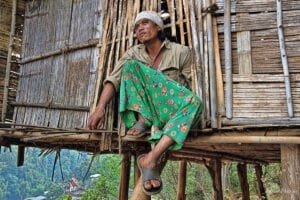 northern thailand hilltribes - a lahu man looking out into the forest - jeffrey warner