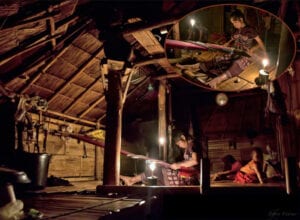 northern thailand hilltribes - jeffrey warner - nam bor noi karen village - woman weaving textiles at night to candlelight