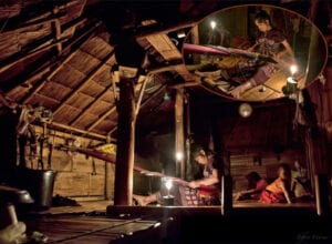 northern thailand hilltribes - jeffrey warner - nam bor noi karen village - woman weaving textiles at night to candlelight